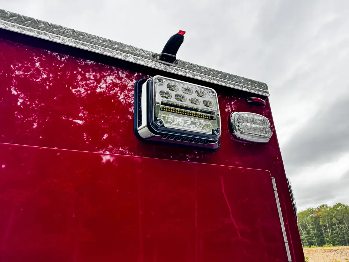 Straight rear exterior view showing closed roll-up door and chevron pattern.